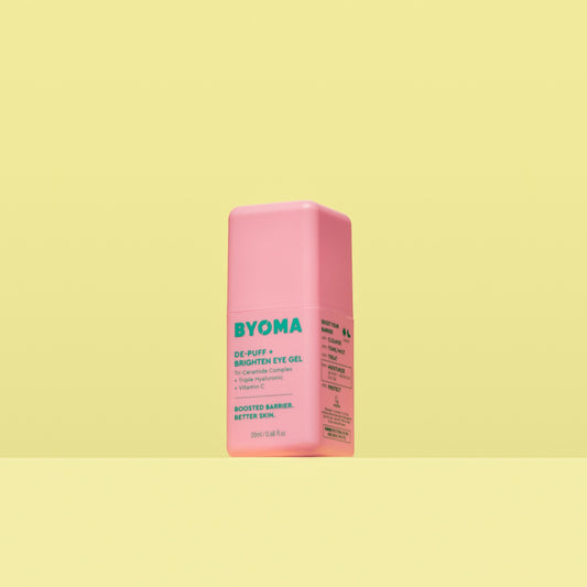 A pink bottle of Byoma De-Puff + Brighten Eye Gel.