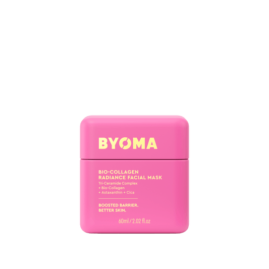 Pink facial mask container with 'BYOMA' branding on a green background