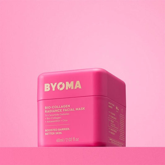 Pink facial mask container with 'BYOMA' branding on a pink background